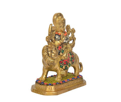 Three-quarter view of Durga Maa with lion, gold tone and multicolour gem-like decorations