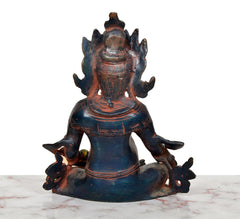 Rear view of Kuber brass murti with ornate back detailing, seated posture