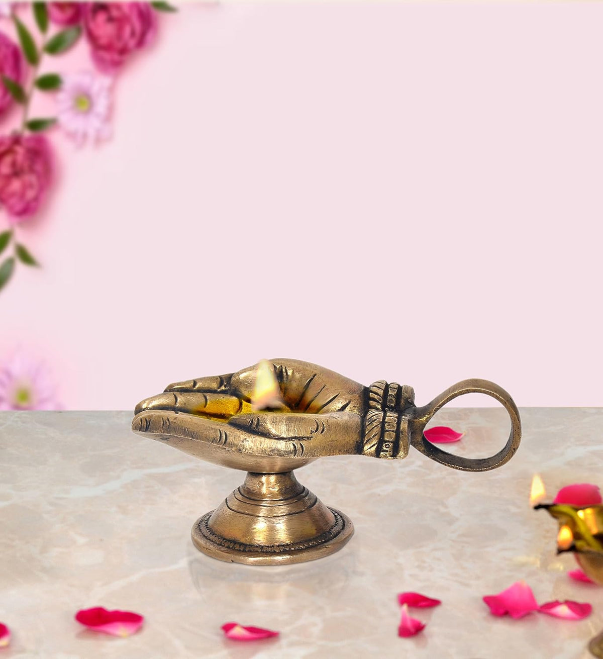 Brass hand-shaped diya with handle oil-wick lamp, small tabletop puja diya