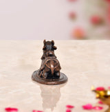 Copper Nandi cow idol on base, rear view with small tail and ornaments