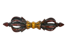 Front view of brass eight-pronged dorje with gold center and dark brown accents