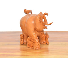 Back/side view wooden elephant showpiece with trunk carving and mini elephants, orange-brown
