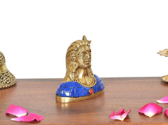 Brass Adiyogi Shiva idol profile, blue patterned shoulders and red bead at neck