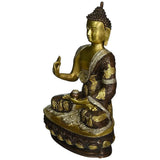 Gold-tone seated Buddha statue in Abhaya mudra, side view, ornate relief base