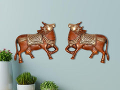 Brass Kamdhenu cow pair wall hanging, two standing cows facing opposite directions