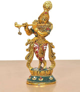Krishna metal sculpture playing flute, gold figure with red ornaments and teal patterned base