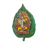 Metal Panchmukhi Hanuman wall hanging angled view with green leaf border and central deity