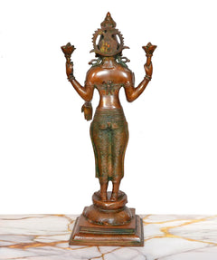 Back view brass Lakshmi murti with multiple-lotus hands, jeweled headpiece, pedestal