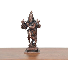 Krishna playing flute figurine in copper-bronze, standing on ornate base