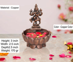 Copper Krishna urli bowl, 3-inch height, lotus rim with deity figurine on center