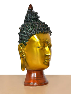 Buddha head wall hanging, gold profile view with dark beaded crown and brown base