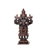 Copper Dhanvantari statue with ornate crown and four arms holding emblems