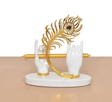 White resin Krishna hands with gold flute and blue peacock tail, curved gold ornament, base