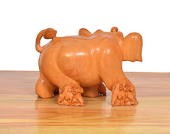 Rear view wooden elephant showpiece with handle-like ear carving and mini elephants, orange-brown