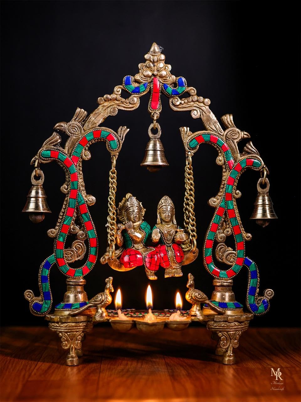 Radha Krishna statue on swing with lamps and diya, ornate gold frame, 36 cm height