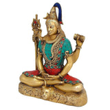 Shiva brass statue, seated cross-legged; trident on left, raised fist; turquoise and red