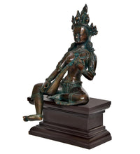 Saraswati idol side view, seated pose with veena, detailed jewelry, dark base