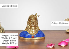 Brass Adiyogi Shiva idol, blue tiled chest with red bead pendant; height 2.5 in