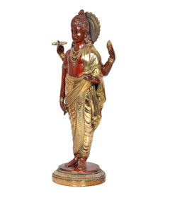 Dhanvantri brass statue side view, crown and four arms, red torso with gold robe