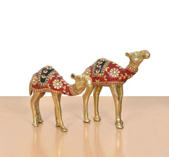 Brass camel figurine pair facing opposite directions, ornate red saddle details