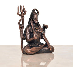 Copper Lord Shiva mandir figurine, seated pose with trident and raised right hand