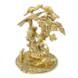 Gold-tone Radha Krishna sitting under tree with birds, detailed leaf and ground carvings