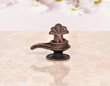 Copper Shiva ling figurine on round base with cobra hoods, side view