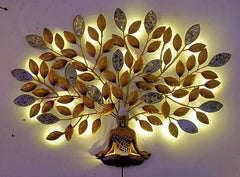 Glowing Buddha wall art: bronze-orange leaf branches with LED lights around central figure