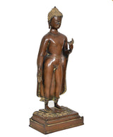 Brass standing Buddha statue three-quarter view, right hand raised, ornate base