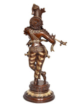 Brass Krishna flute idol statue from back view, circular back ornament and round base