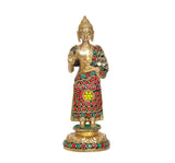 Brass standing Buddha idol with Abhaya mudra pose, red robe with blue and green gems
