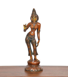 Brass goddess statue three-quarter view, standing on round base, blessing hand raised