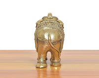Bronze elephant figurine, back view with carved head details and patterned ankles