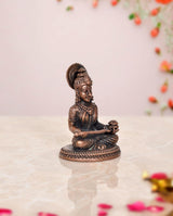 Annapurna copper idol, angled view showing seated goddess posture and detailed headdress