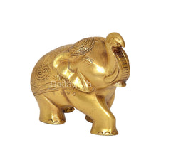 Brass elephant statue, angled side view with engraved patterns on back