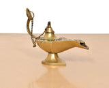 Brass genie lamp with chain handle and etched patterns on the spout and body