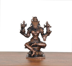 Varahi figurine, eight arms holding ornaments, seated deity with bronze-copper look