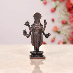 Copper Dhanvantari statue, back view, four hands with emblems, on pedestal base