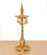 Golden metal diya stand with peacock figure, hanging lamps, and elephant base