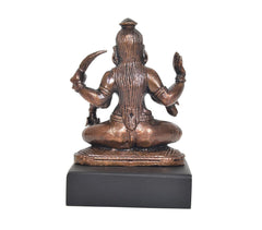 3-inch copper Mahakaali Mata idol, back view seated multi-armed figure on dark base