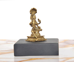 Rear/angled view of golden Durga idol on dark base, detailed ornaments