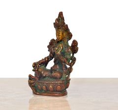 Brass Tara Devi statue, side view of seated multi-armed goddess on carved lotus base