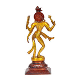 Brass Ardhanrishvara statue from behind, circular red back ornament and gold torso