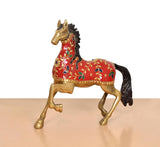 Brass running horse statue with red patterned coat, gold trim, and black tail
