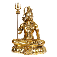 Brass seated Shiva statue with tall trident, layered necklaces, and ornate lotus base.