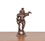 Copper Bal Krishna showpiece, dancing stance holding laddu, front view on round base