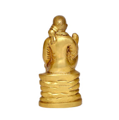 Brass Shirdi Sai Baba statue, rear view with robe folds and textured base