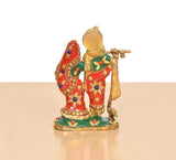 Brass Radha-Krishna idol from back, green base with red-and-green painted garments