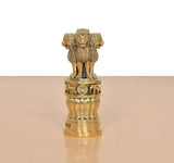 Bronze Ashoka Stambh side view with lion figure and decorative ringed pedestal base.