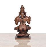 Copper Dhanvantari statue rear view, seated back details, dark patina base